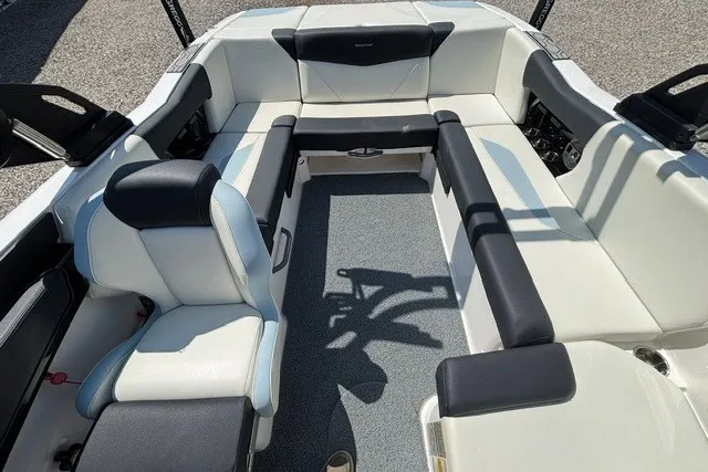 Slide: The Image of 2022 MasterCraft NXT22 boat interior with spacious seating and modern design. - 7