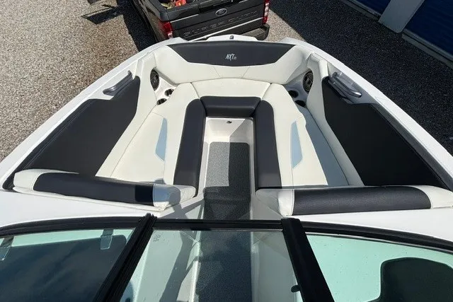 Slide: The Image of 2022 MasterCraft NXT22 boat interior with sleek seating and modern design. - 4