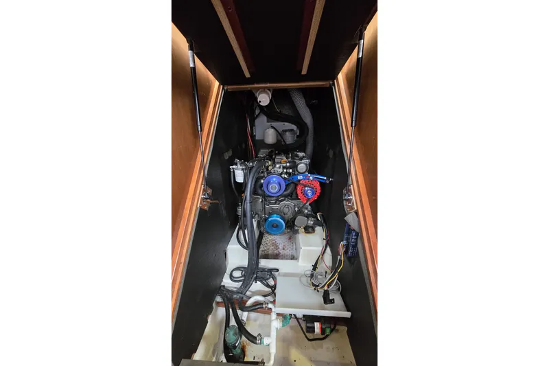 Slide: The Image of Engine compartment of a 2012 Beneteau Oceanis 45 sailboat, showcasing mechanical components. - 26