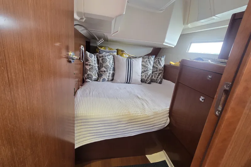 Slide: The Image of Cozy cabin interior of 2012 Beneteau Oceanis 45 yacht with elegant bedding. - 21