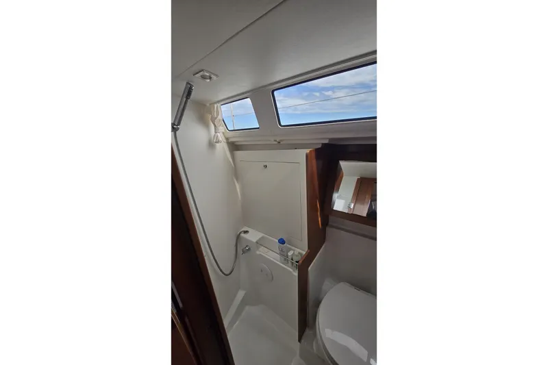 Slide: The Image of Beneteau Oceanis 45 (2012) yacht bathroom with shower and window view. - 25