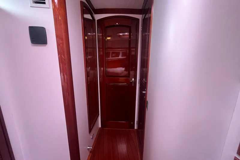 Slide: The Image of Narrow hallway with wooden doors inside a 2008 Bruckmann 50 MKII yacht. - 11