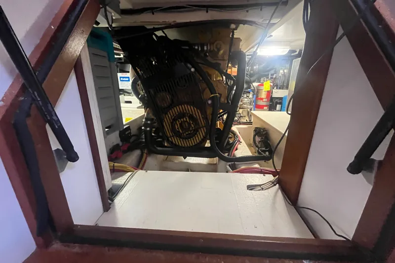Slide: The Image of Engine room of a 2008 Bruckmann 50 MKII yacht, showcasing mechanical components. - 58