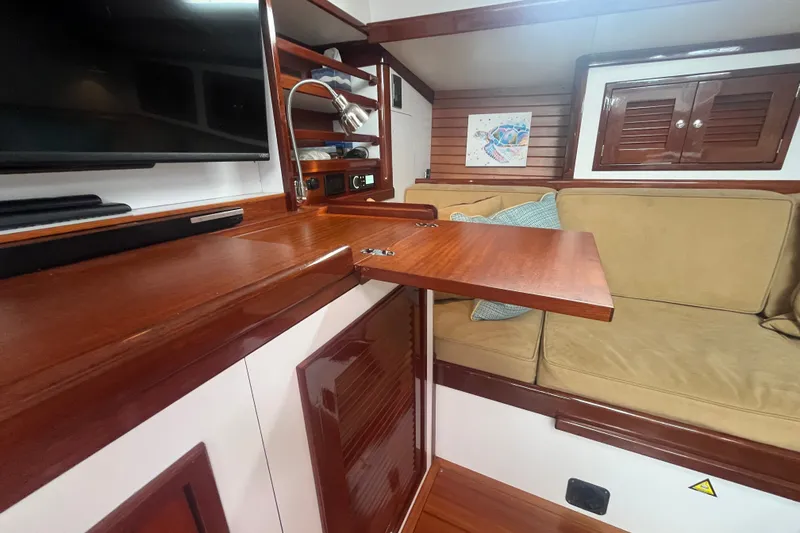 Slide: The Image of Interior of 2008 Bruckmann 50 MKII yacht with wooden cabinetry and beige seating. - 25