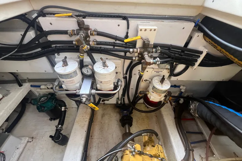 Slide: The Image of Engine room of 2008 Bruckmann 50 MKII yacht, showcasing fuel filtration system and piping. - 66