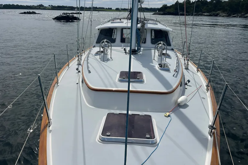 Slide: The Image of Bruckmann 50 MKII yacht, 2008 model, sailing on calm waters with scenic shoreline. - 50