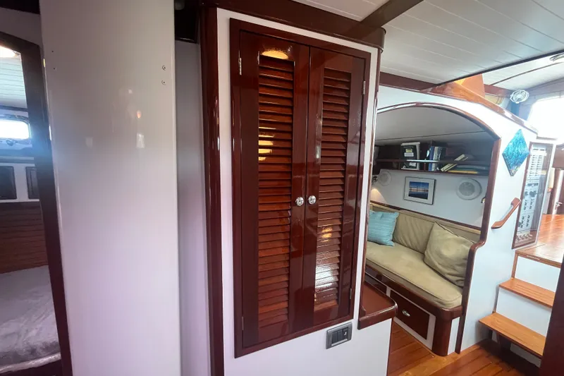 Slide: The Image of Interior of 2008 Bruckmann 50 MKII yacht with wooden cabinetry and cozy seating area. - 21