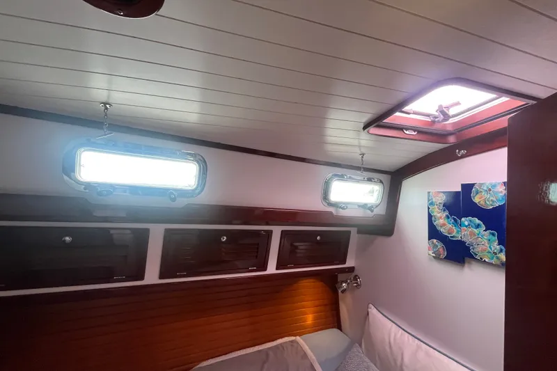 Slide: The Image of Cozy cabin interior of 2008 Bruckmann 50 MKII yacht with portholes and artwork. - 19
