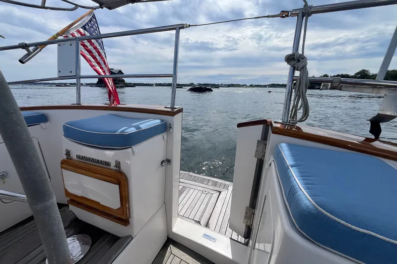Slide: The Image of Bruckmann 50 MKII yacht deck with American flag, ocean view, and blue cushions, 2008 model. - 46