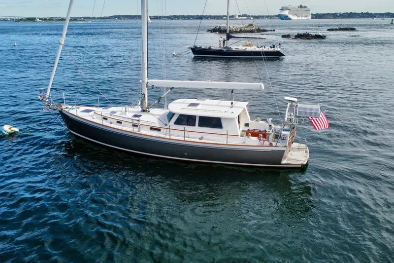 Slide: The Image of Sailing yacht Bruckmann 50 MKII, 2008 model, anchored in calm waters with American flag. - 5
