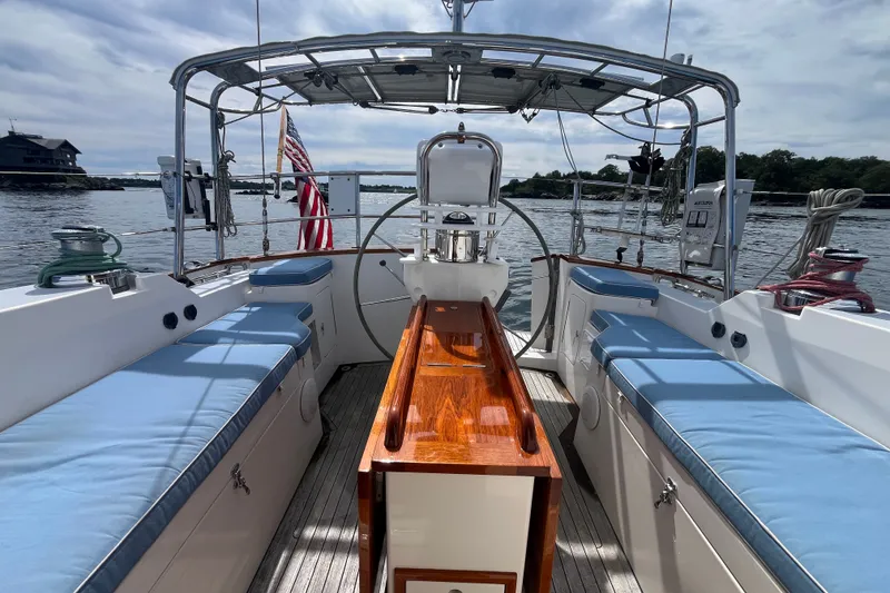 Slide: The Image of Cockpit of 2008 Bruckmann 50 MKII yacht with blue cushions and wooden accents. - 43