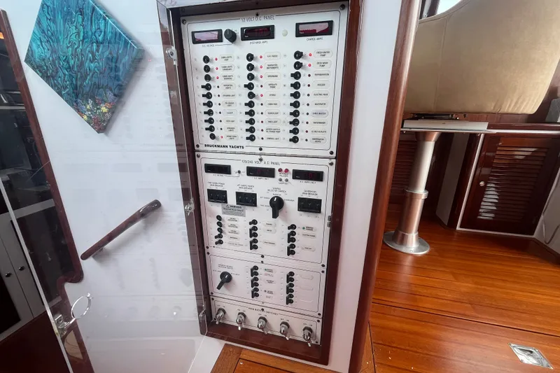 Slide: The Image of Electrical panel on a 2008 Bruckmann 50 MKII yacht, featuring control switches and gauges. - 56