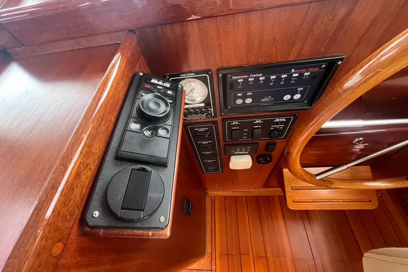 Slide: The Image of Control panel of a 2008 Bruckmann 50 MKII yacht with wooden finish and navigation equipment. - 61