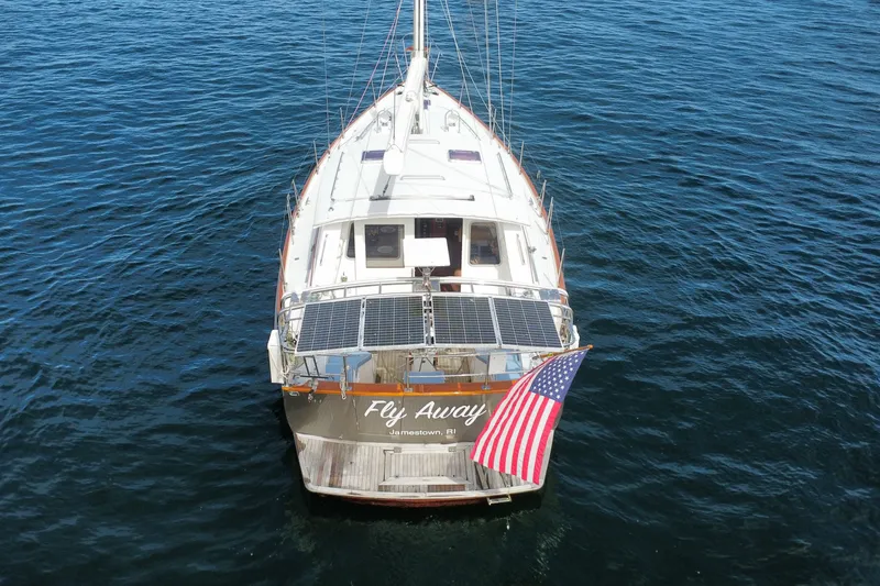 Slide: The Image of Aerial view of 2008 Bruckmann 50 MKII yacht with solar panels and American flag. - 74