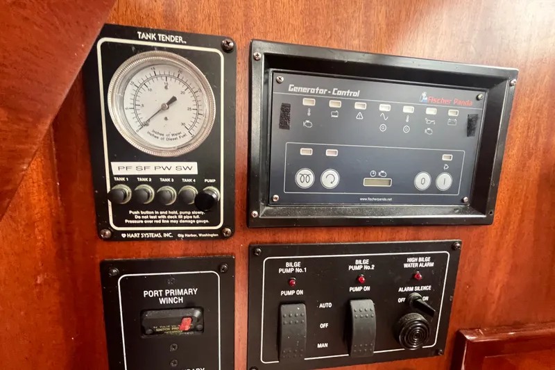 Slide: The Image of Control panel of a 2008 Bruckmann 50 MKII yacht with gauges and switches. - 62