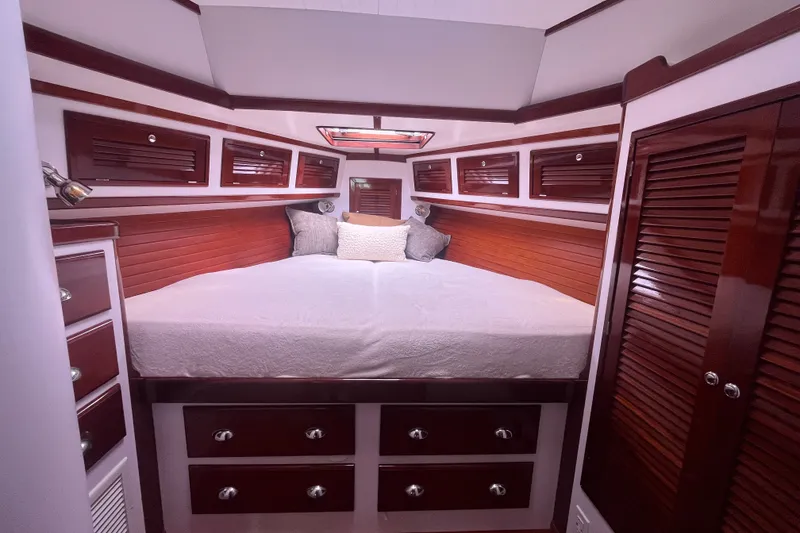 Slide: The Image of Luxurious cabin interior of 2008 Bruckmann 50 MKII yacht with wood paneling and cozy bedding. - 6