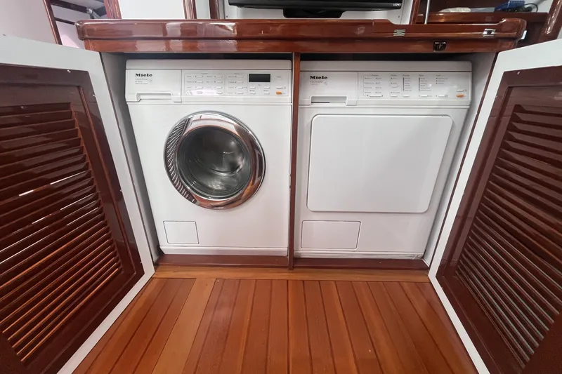 Slide: The Image of Laundry appliances on a 2008 Bruckmann 50 MKII yacht, featuring Miele washer and dryer. - 26