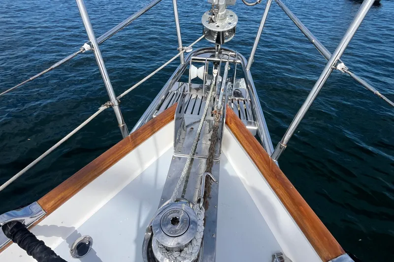 Slide: The Image of Bow of 2008 Bruckmann 50 MKII yacht with anchor and railing over water. - 51