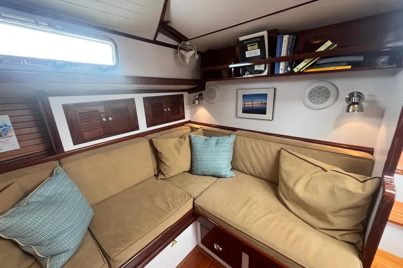Slide: The Image of Cozy interior of 2008 Bruckmann 50 MKII yacht with cushioned seating and wooden shelves. - 27