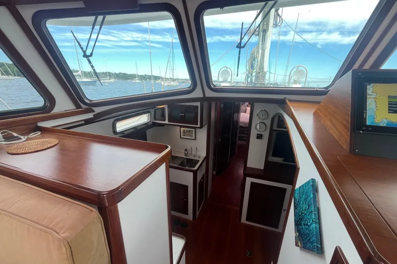 Slide: The Image of Interior view of 2008 Bruckmann 50 MKII yacht with wood finish and navigation equipment. - 42