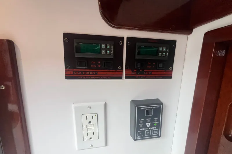 Slide: The Image of Control panels on a 2008 Bruckmann 50 MKII yacht, featuring Sea Frost and Trident Marine systems. - 57