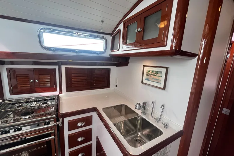 Slide: The Image of Luxurious 2008 Bruckmann 50 MKII yacht kitchen with wood cabinetry and stainless steel sink. - 30