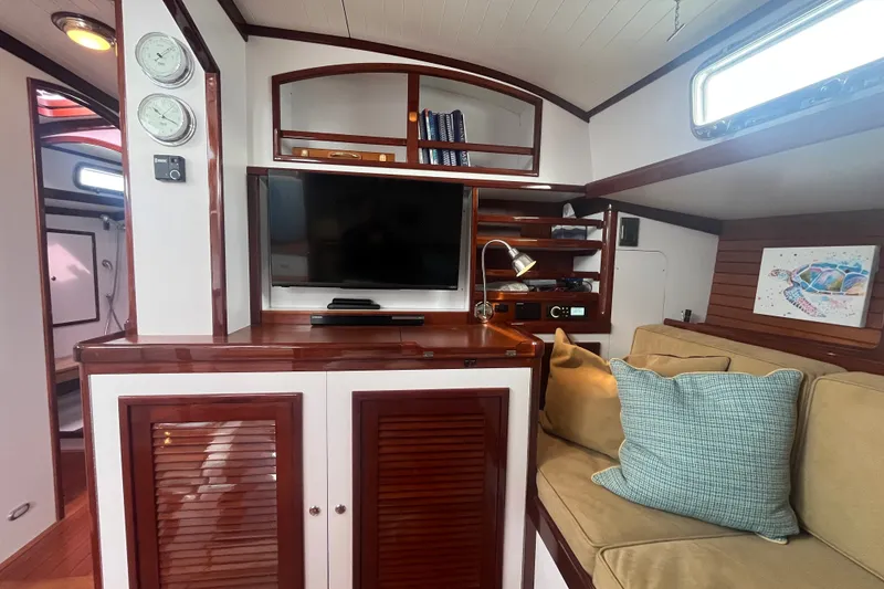 Slide: The Image of Luxurious 2008 Bruckmann 50 MKII yacht interior with cozy seating, TV, and elegant wood finishes. - 24