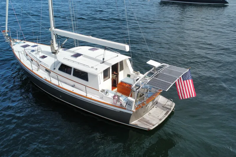 Slide: The Image of Sailing yacht Bruckmann 50 MKII 2008 with solar panels and American flag on water. - 4