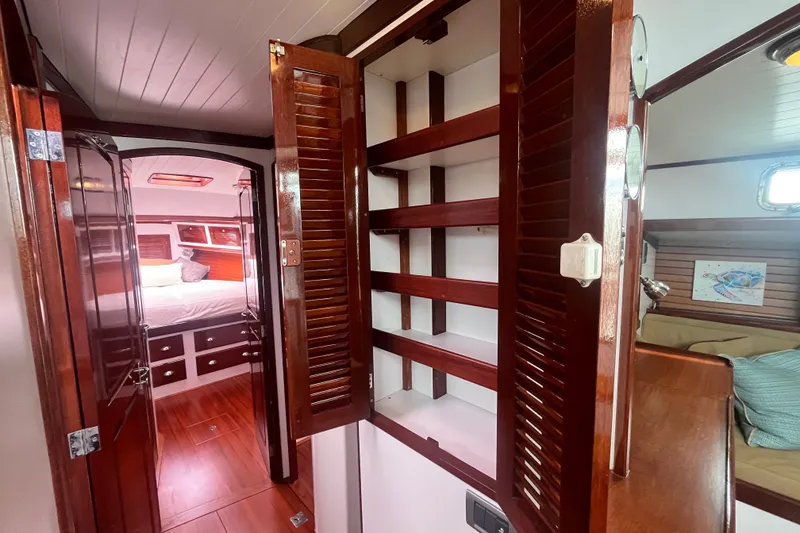 Slide: The Image of Luxurious interior of 2008 Bruckmann 50 MKII yacht with wooden cabinetry and cozy bedroom. - 22