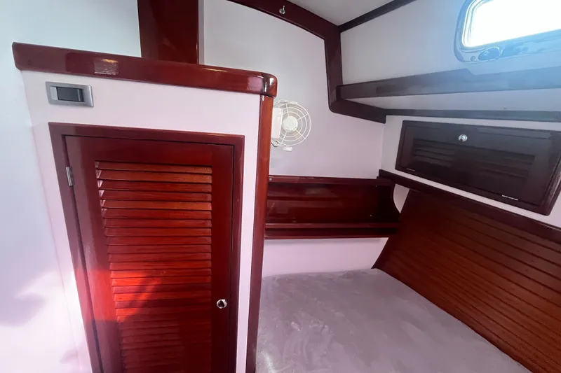 Slide: The Image of Cozy cabin interior of 2008 Bruckmann 50 MKII yacht with wooden finishes and storage. - 17
