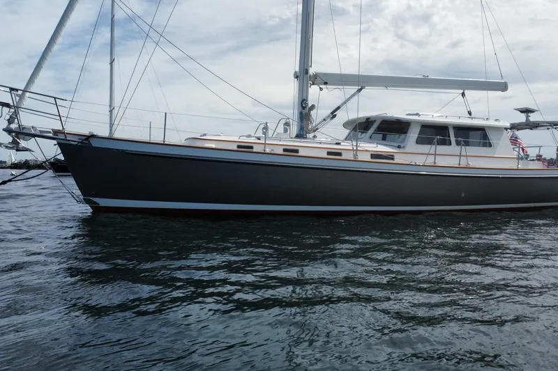 Slide: The Image of 2008 Bruckmann 50 MKII yacht on calm water under cloudy sky. - 3