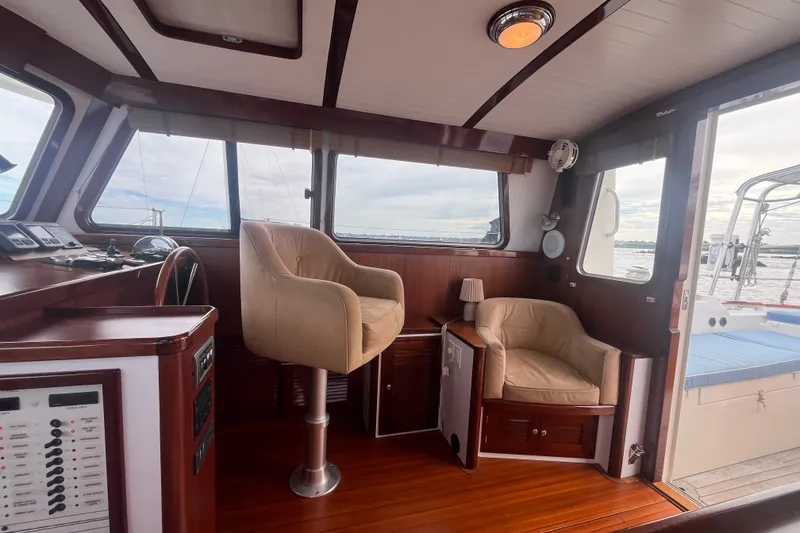 Slide: The Image of Luxurious interior of 2008 Bruckmann 50 MKII yacht with plush seating and wooden accents. - 39