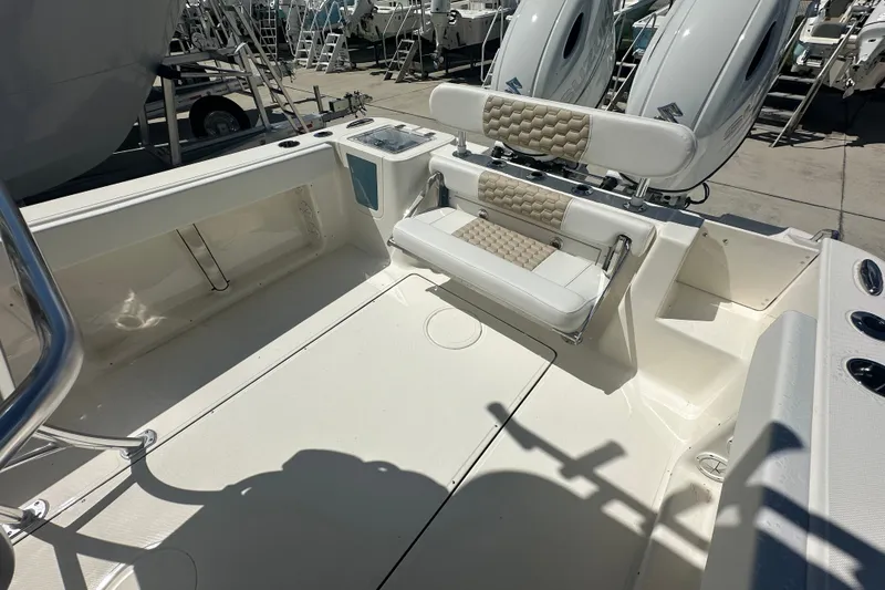 Slide: The Image of 2027 Bulls Bay 255 Center Console boat interior with seating and storage compartments. - 15