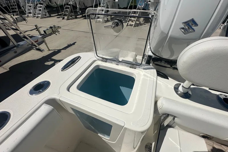 Slide: The Image of 2027 Bulls Bay 255 Center Console boat with open storage compartment. - 16