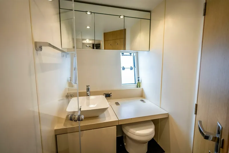 Slide: The Image of Luxurious bathroom in 2015 Fairline Targa 48 Open yacht, featuring modern fixtures and elegant design. - 24