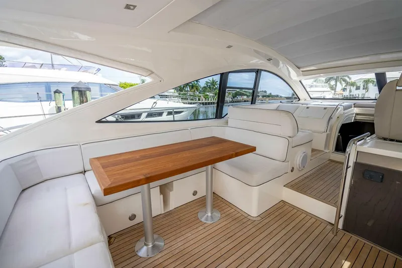 Slide: The Image of 2015 Fairline Targa 48 Open yacht interior with wooden table and white seating. - 30
