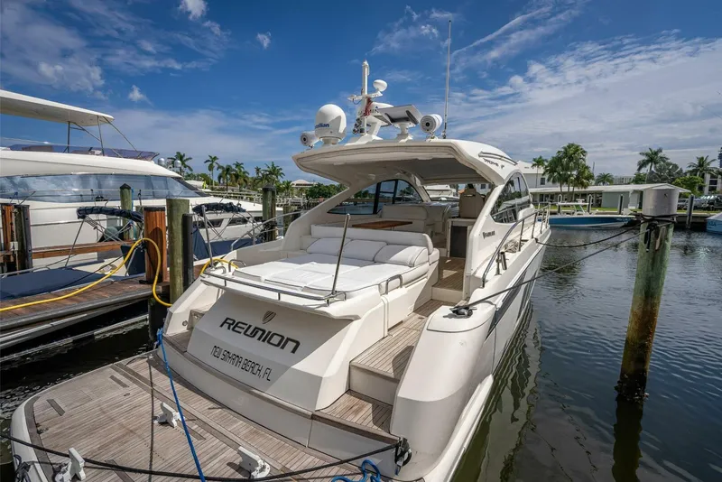 Slide: The Image of 2015 Fairline Targa 48 Open yacht docked at marina under blue sky. - 39