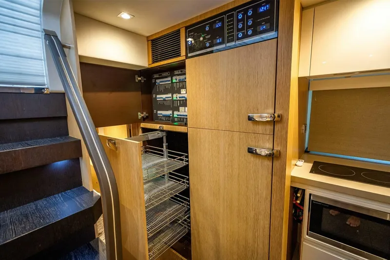 Slide: The Image of Interior of 2015 Fairline Targa 48 Open yacht with modern kitchen and storage. - 18