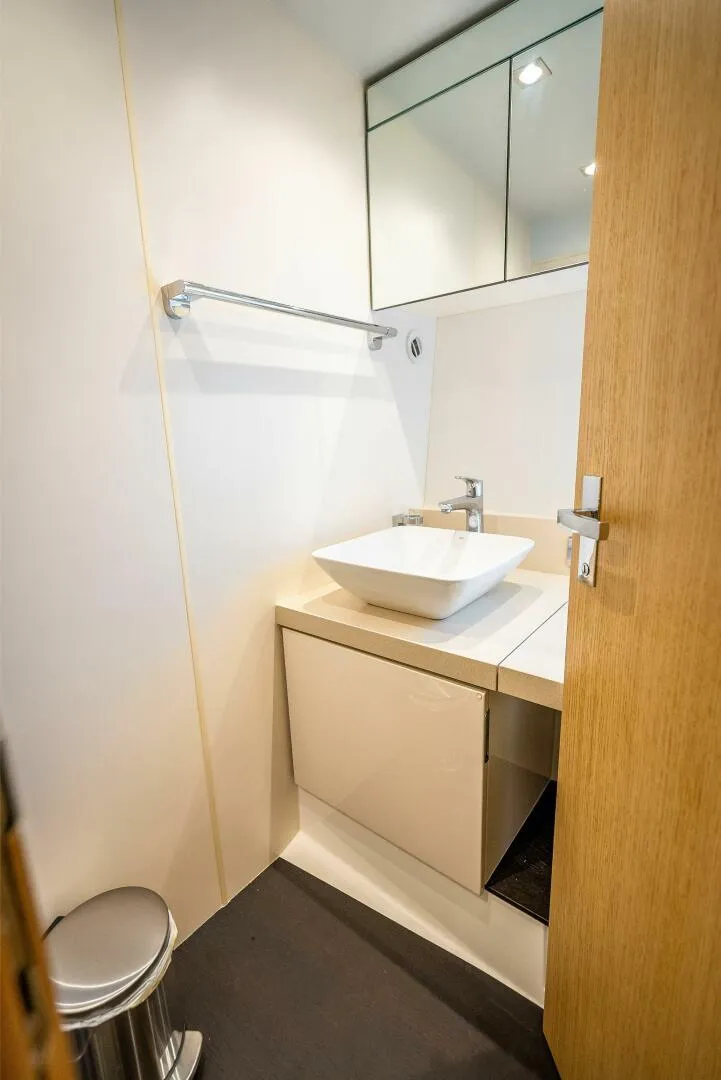 Slide: The Image of 2015 Fairline Targa 48 Open bathroom with modern sink and mirror. - 23