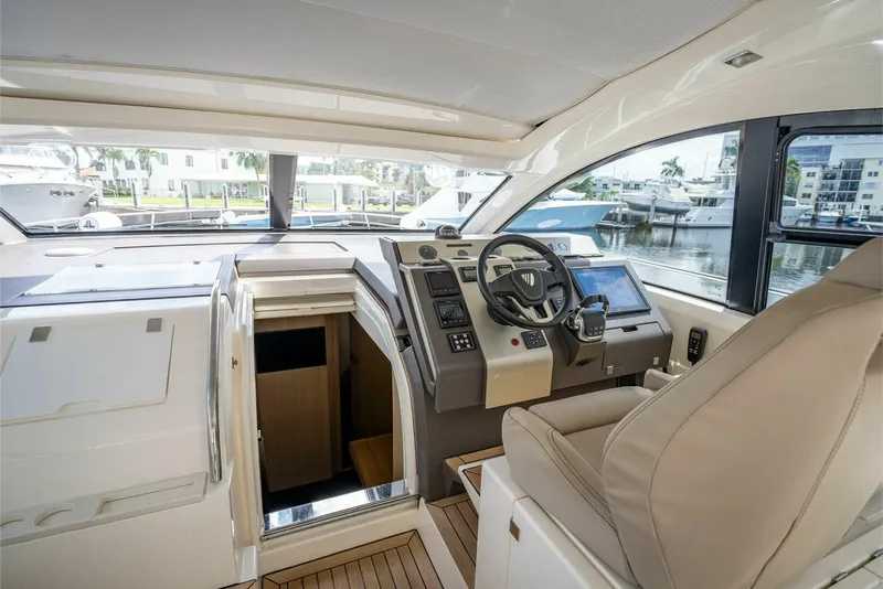 Slide: The Image of Interior view of 2015 Fairline Targa 48 Open yacht cockpit with helm and seating. - 26