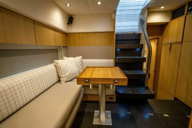 Slide: The Image of Interior of 2015 Fairline Targa 48 Open yacht with seating and wooden table. - 15