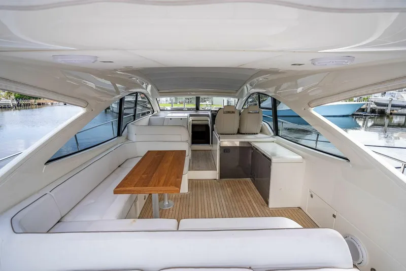 Slide: The Image of 2015 Fairline Targa 48 Open yacht interior with white seating and wooden table. - 33