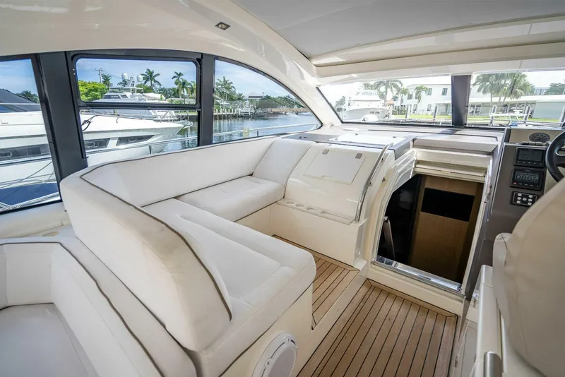 Slide: The Image of Luxurious interior of 2015 Fairline Targa 48 Open yacht with white seating and wood flooring. - 25