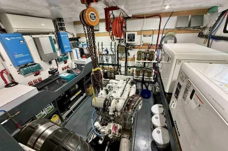 Slide: The Image of Engine room of 2018 Avenger Custom Luxury Catamaran Coastal Cruiser, featuring advanced equipment and generators. - 38