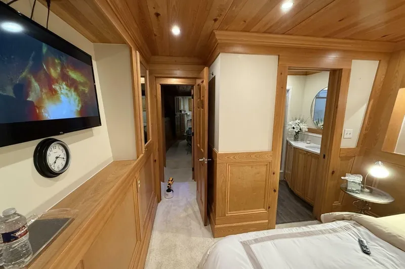 Slide: The Image of Luxurious interior of 2018 Avenger Custom Catamaran, featuring wood paneling and modern amenities. - 30