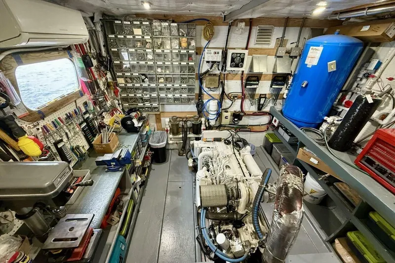 Slide: The Image of Engine room of 2018 Avenger Custom Luxury Catamaran, featuring organized tools and equipment. - 40