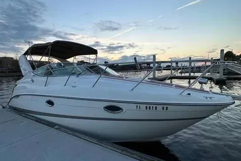 The Image of 2003 Maxum 2900 SE boat docked at sunset with calm waters. - 0
