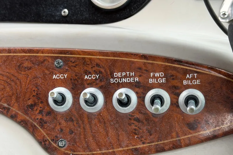 Slide: The Image of Control panel of a 2003 Maxum 2900 SE boat with labeled switches. - 39