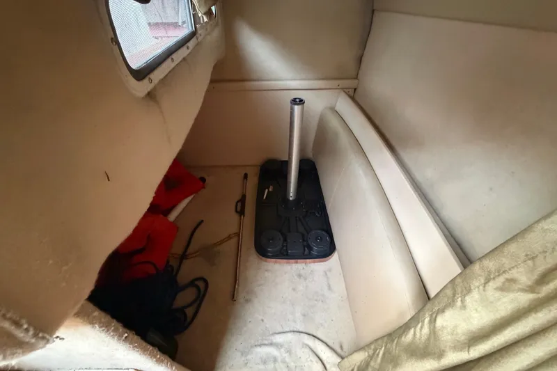 Slide: The Image of Interior cabin of 2003 Maxum 2900 SE boat with storage items. - 84