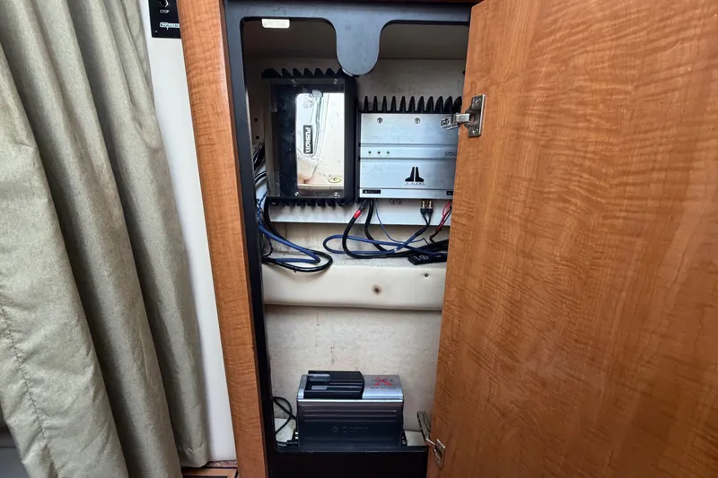 Slide: The Image of Electrical components inside a 2003 Maxum 2900 SE boat cabinet. - 56